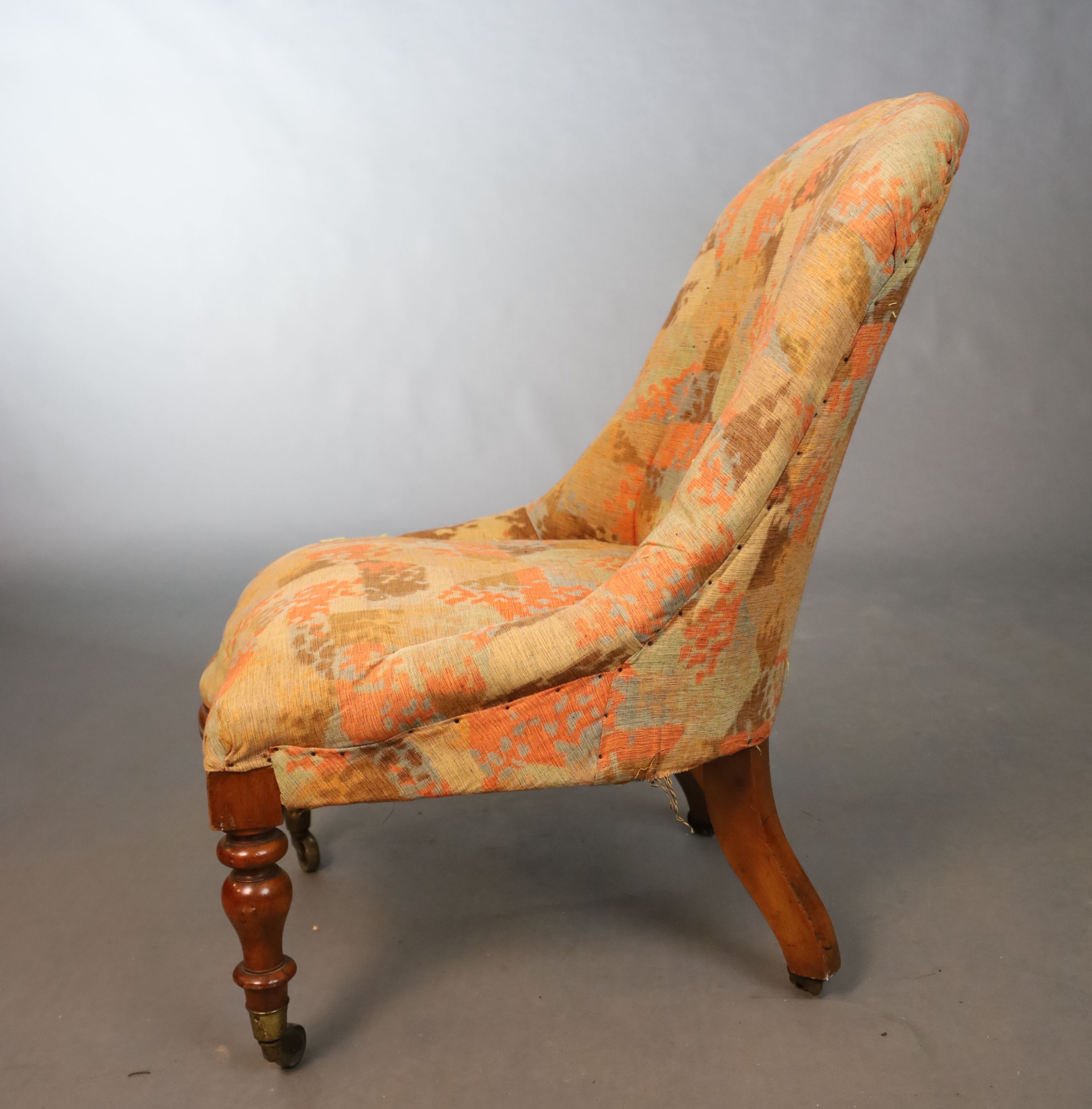 A Victorian walnut nursing chair, W.51cm D.76.5cm H.84cm